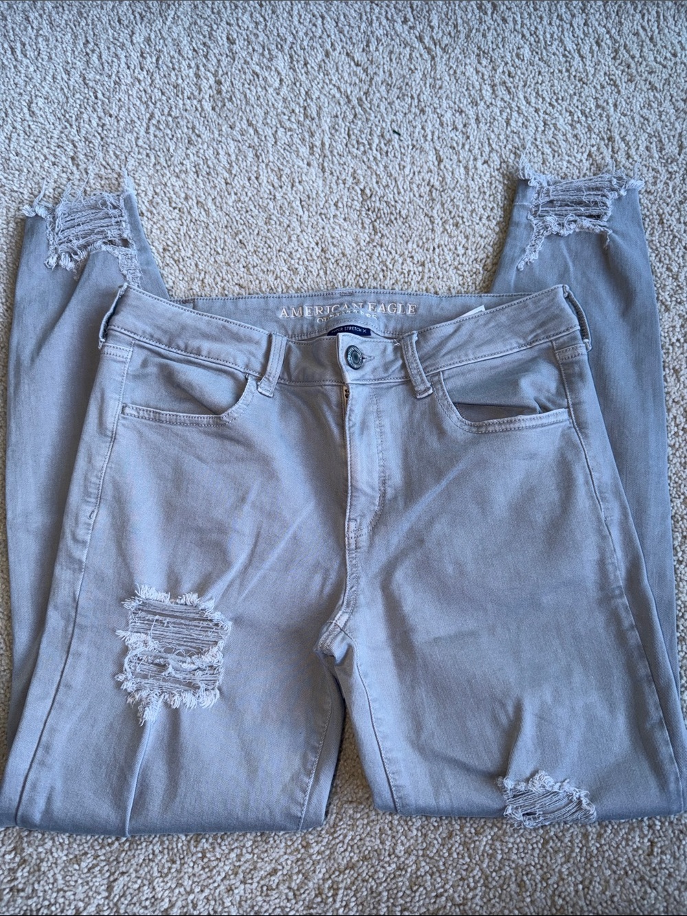 American Eagle Outfitters Women’s Skinny Ripped Jeans in Light Gray